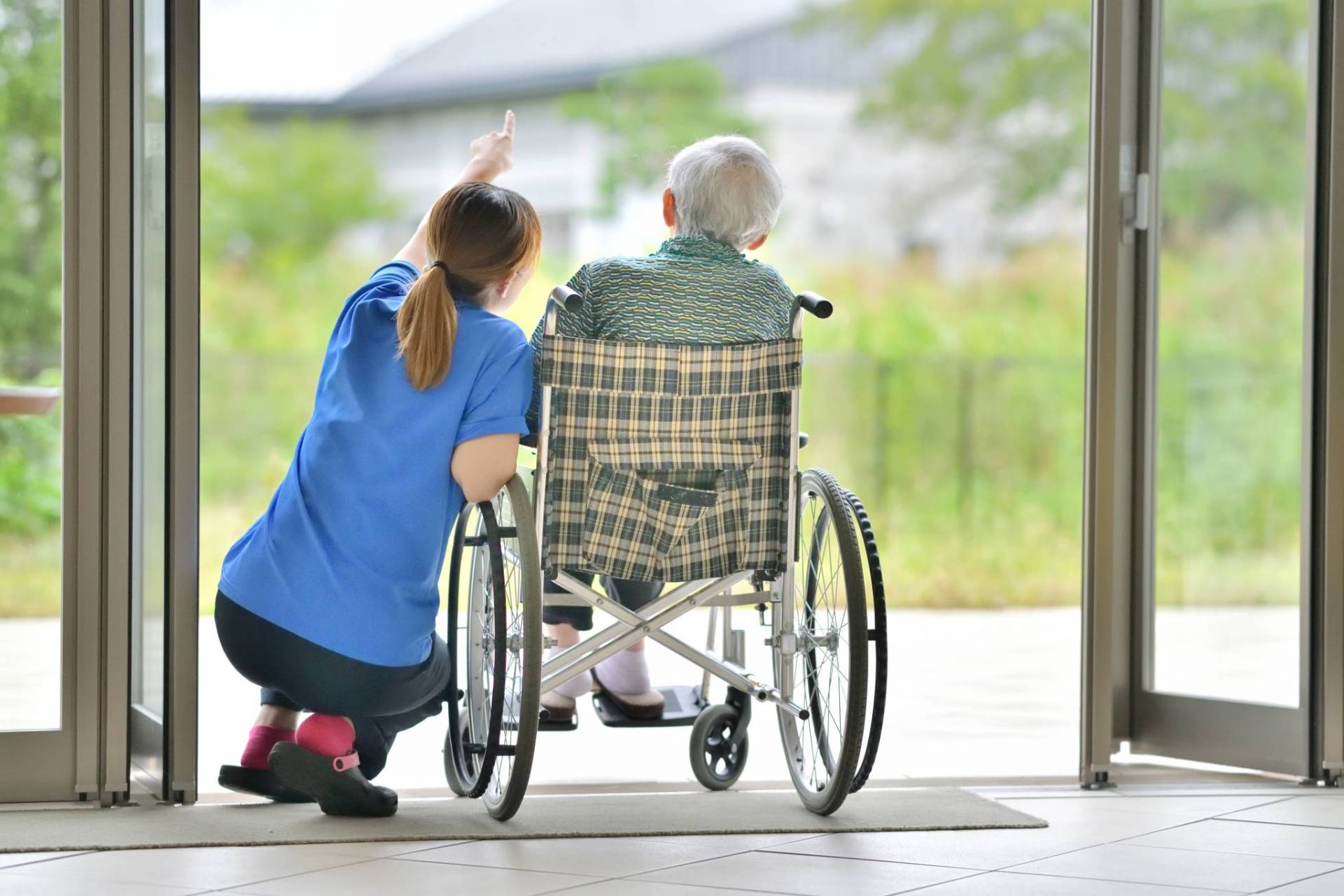 TriCare Aged Care Locations UMG resident on wheelchair
