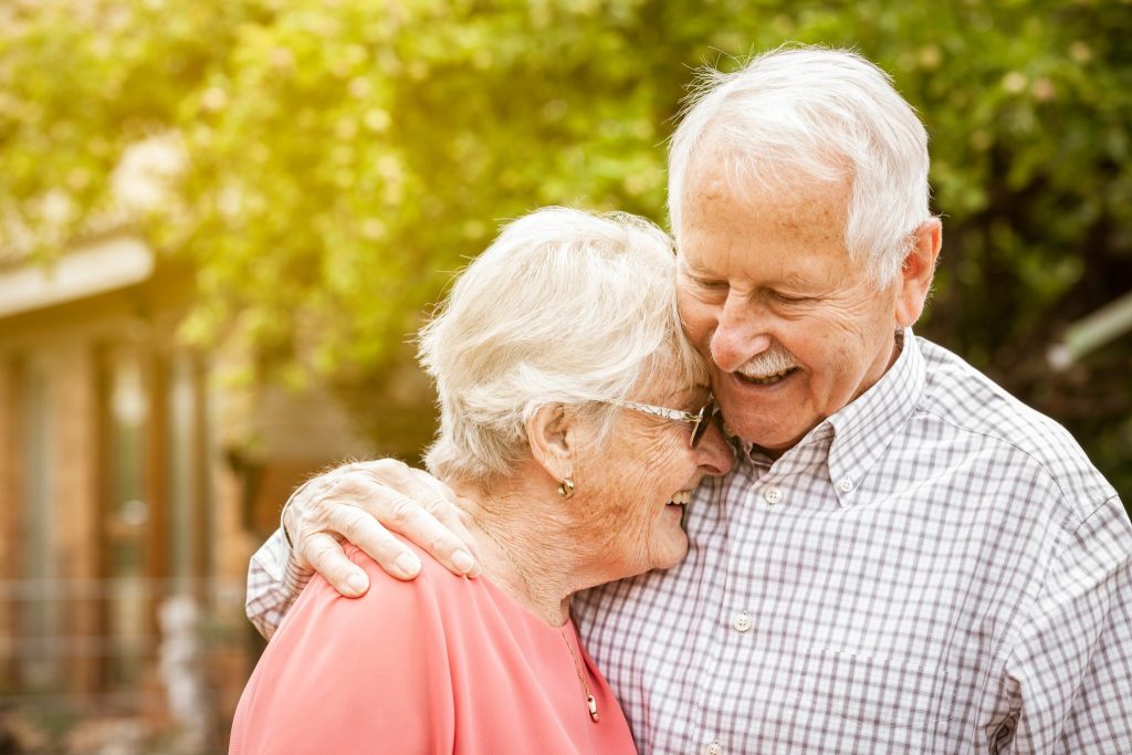 http://aged%20care%20couple%20laughing%20and%20hugging