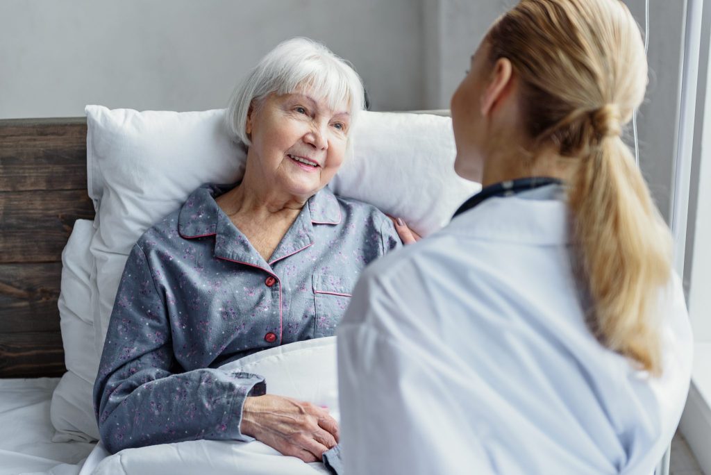 Senior woman in hospital bed