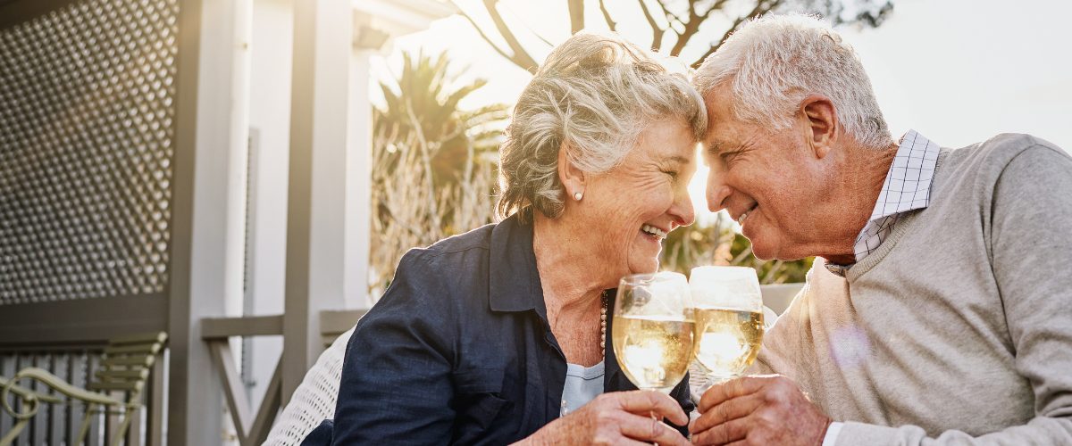Couple in aged care with wine