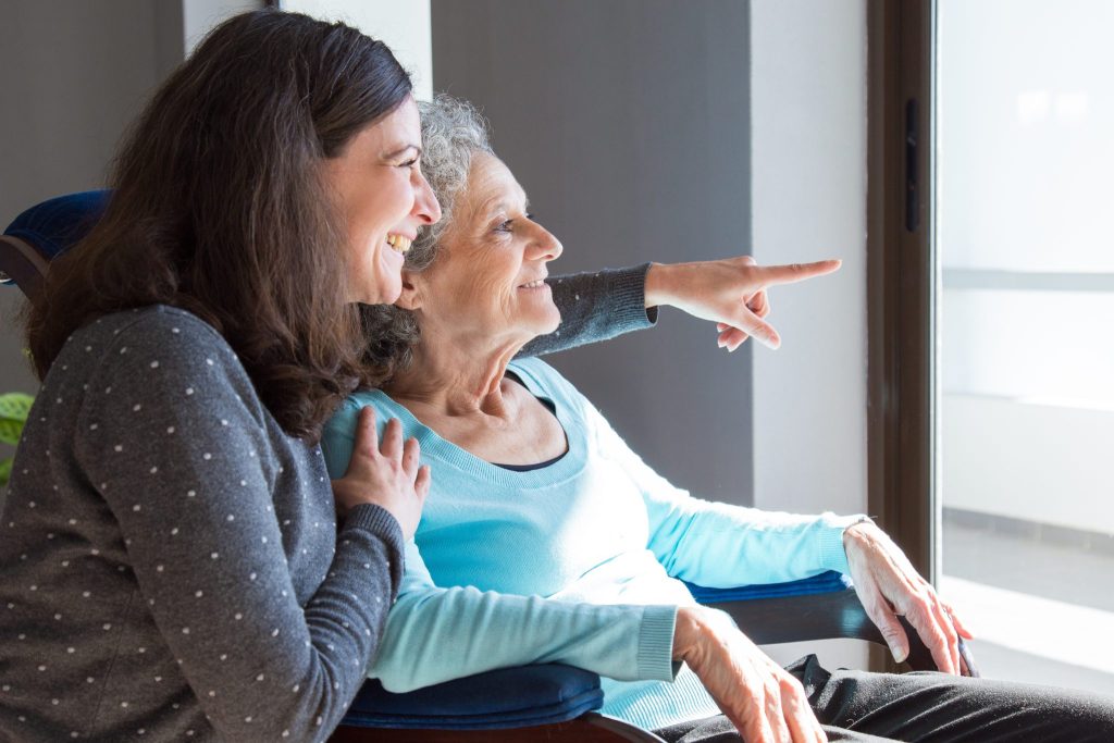 Woman with senior mother parent